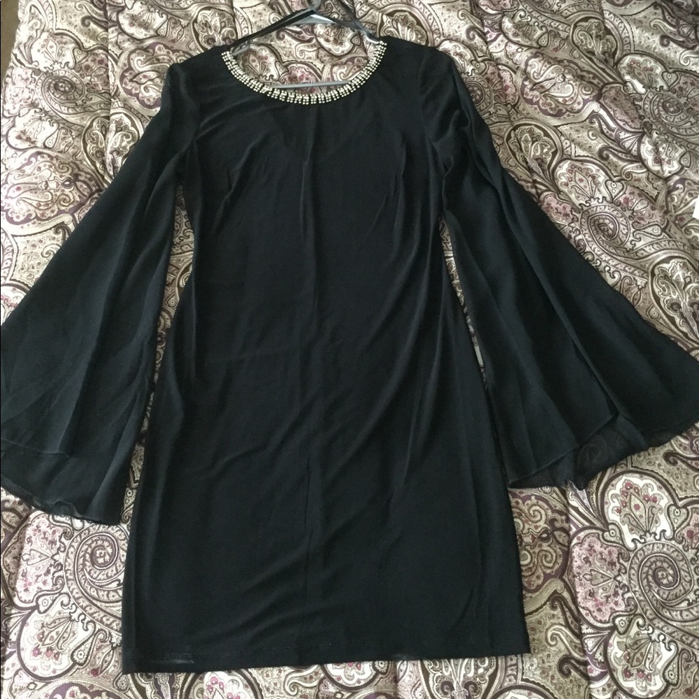 New w/o tags. Black long sleeve, knee length dress